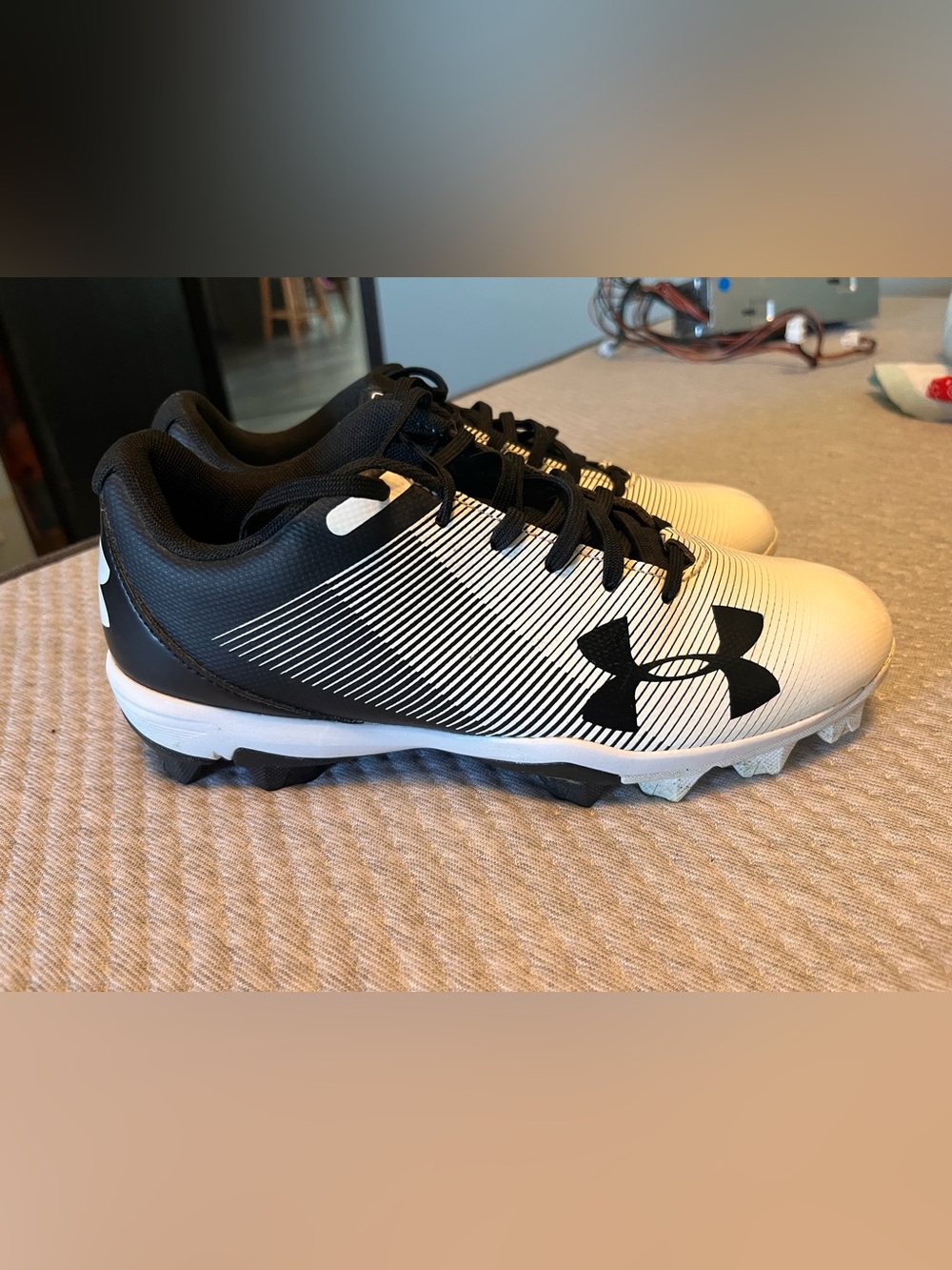 Under Armour youth Black and White Athletic Cleats - Logo Accent -6Y